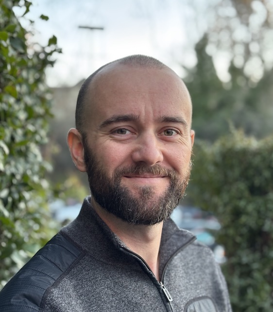 Harrison, genuinely smiling (see the wrinkles around the eyes) in January 2026.