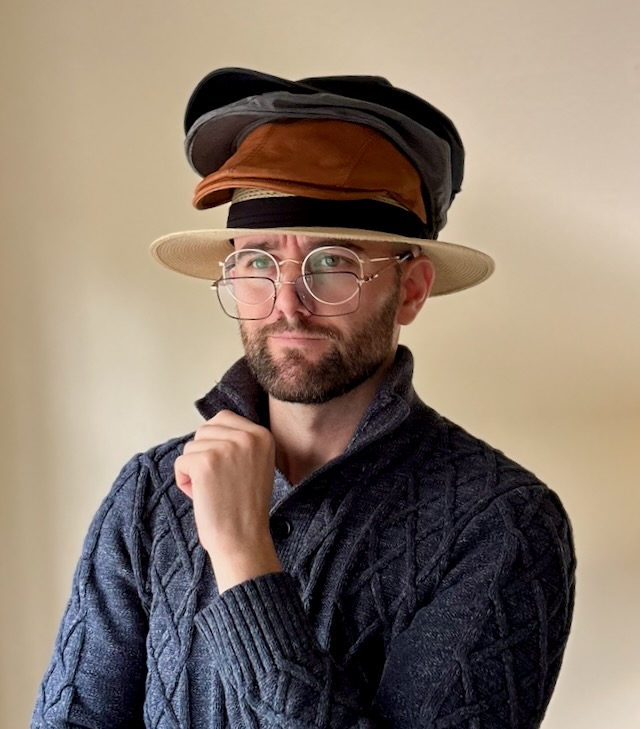 Harrison, literally wearing many hats.